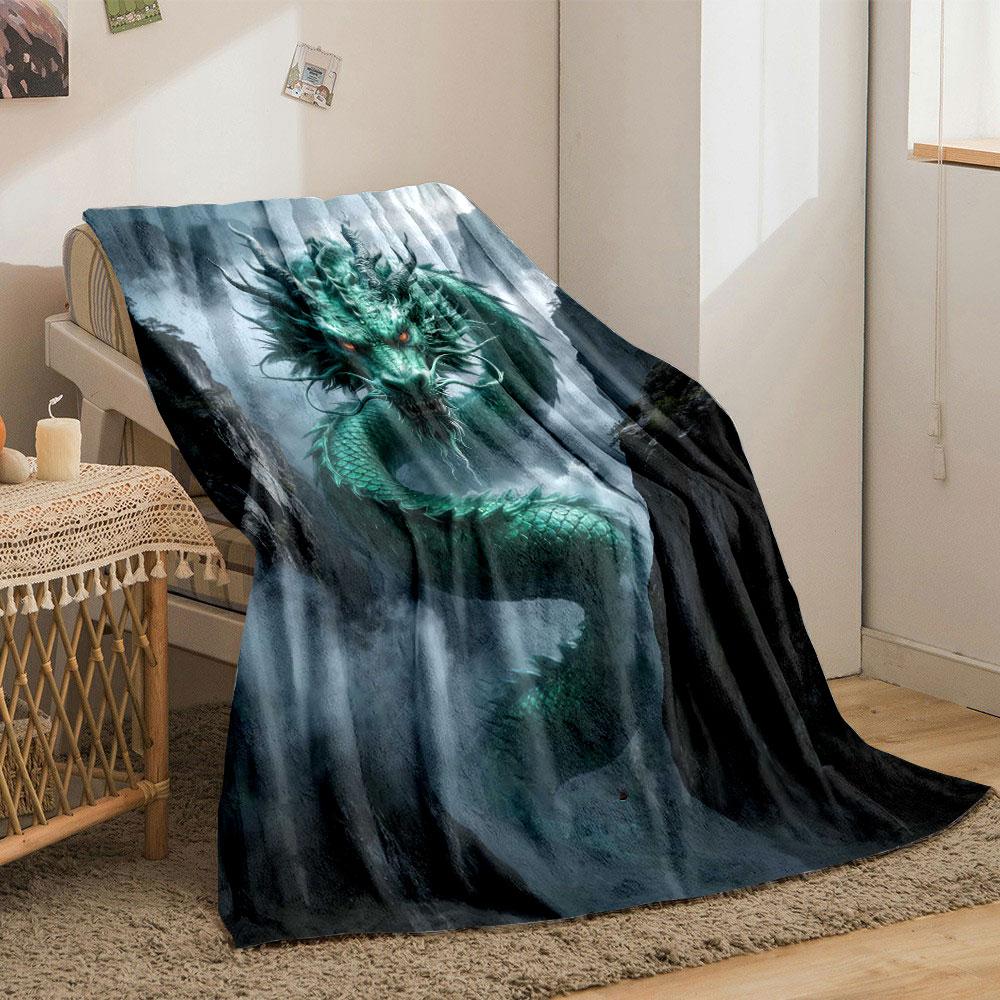 A green, serpentine dragon with glowing eyes emerges amidst misty cliffs. for all seasons blanket lunch break throw gift