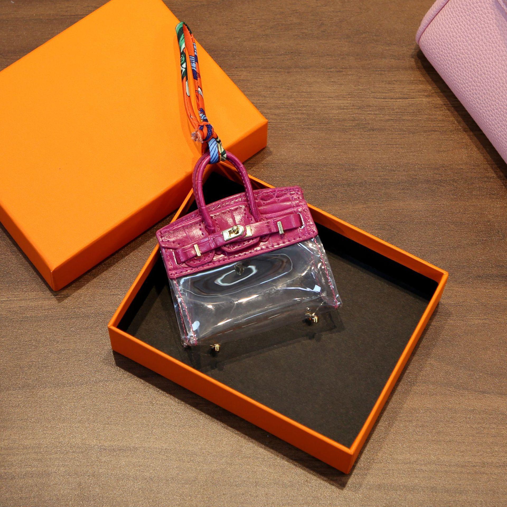 

Интернет-сумка для ключей знаменитости Прозрачная платиновая сумка Мини-подвеска Наушники Помада Ключи от машины Нулевой кошелек Автомобильные аксессуары для женщин 8.5x3x10cm оранжевый