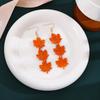 Elegant Maple Leaf Tassel Earrings - Red Acrylic Dangles for a Face-Slimming Effect