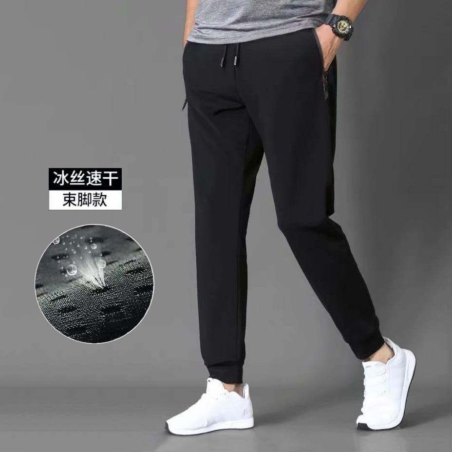 

Air conditioning cloth mesh nine-point pants men s slim-fitting small feet closed feet hollowed out black trendy sports long pants M