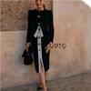 Spring New Women's Clothing Hepburn Style Polka Dot Stitching Skirt + round Neck Long Sleeves Button Decoration Suit Outwear