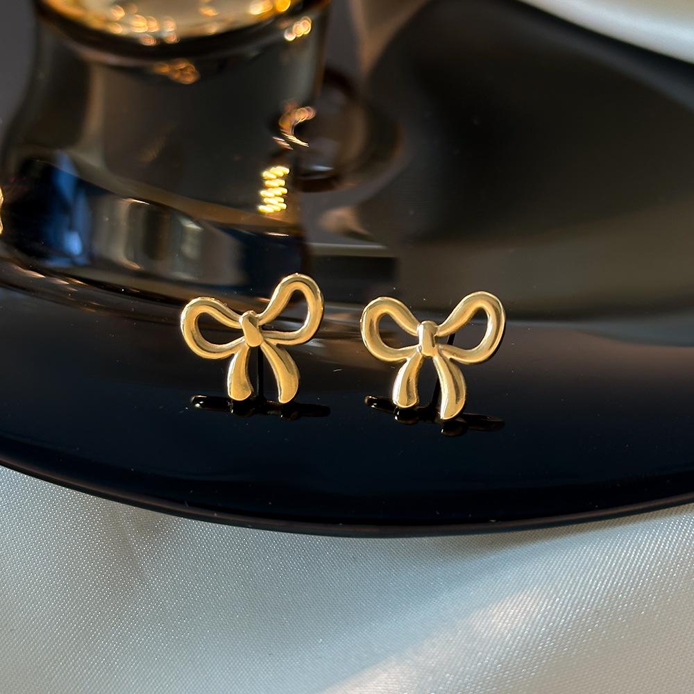 

Wen Jian Bow Tie Titanium Steel Stud Earrings: Trendy, Simple, Cool Style for Women 2023