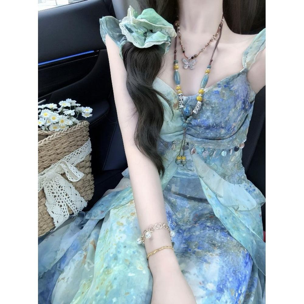 Beach skirt 2025 summer new suspender temperament dress women's summer printing thin dress holiday style