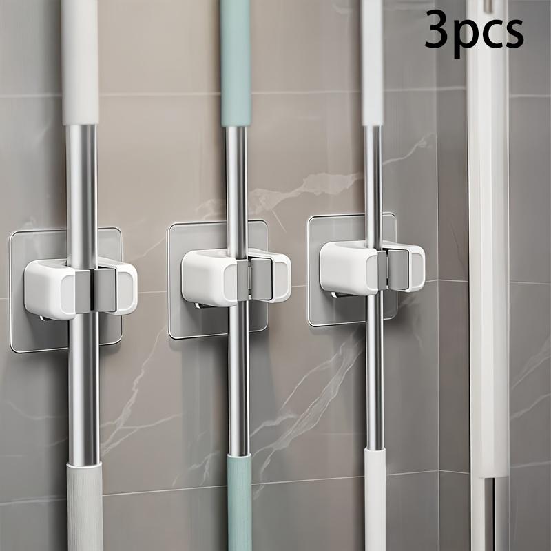 

No-Drill Mop & Broom Rack, 3PCS – Strong Plastic,Space-Saving Upright Storage for Home/Kitchen/Bathroom, Easy Self-Installation.