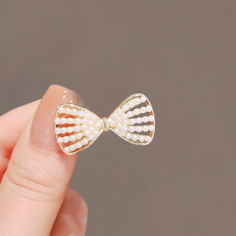 Light luxury bow high-end rhinestone brooch women's new temperament suit versatile clothes pin brooch anti-light buckle