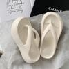Slippers women summer wear flip-flops thick bottom heightening new non-slip deodorant seaside beach bathing stepping on shit feeling
