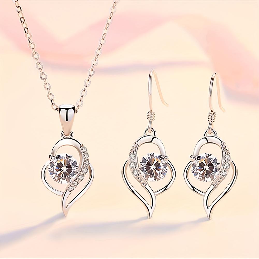 This two-piece set includes a stylish pendant necklace and a pair of unique geometric earrings, perfect for women серебряный