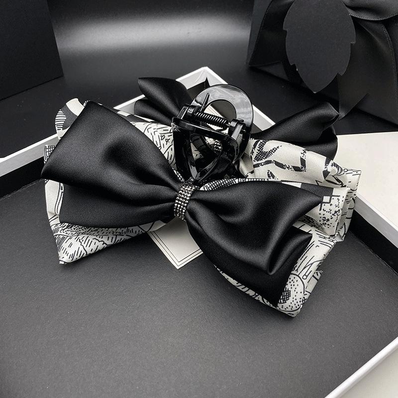 

Hepburn-Style Bow Hair Clip: High-End Women s Shark Hair Accessory for Elegant Updos.