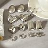 Trendy minimalist polished stainless steel heart-shaped geometric stud earrings for women, fashionable and high-end