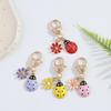 Portable Functional Charm Featuring Artistic Ladybird and Daisy Design for Various Decorative Uses On Essential Item