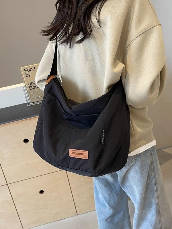 Minimalist Canvas Shoulder Bag With Sewn Detailing And Spacious Interior For Commuting