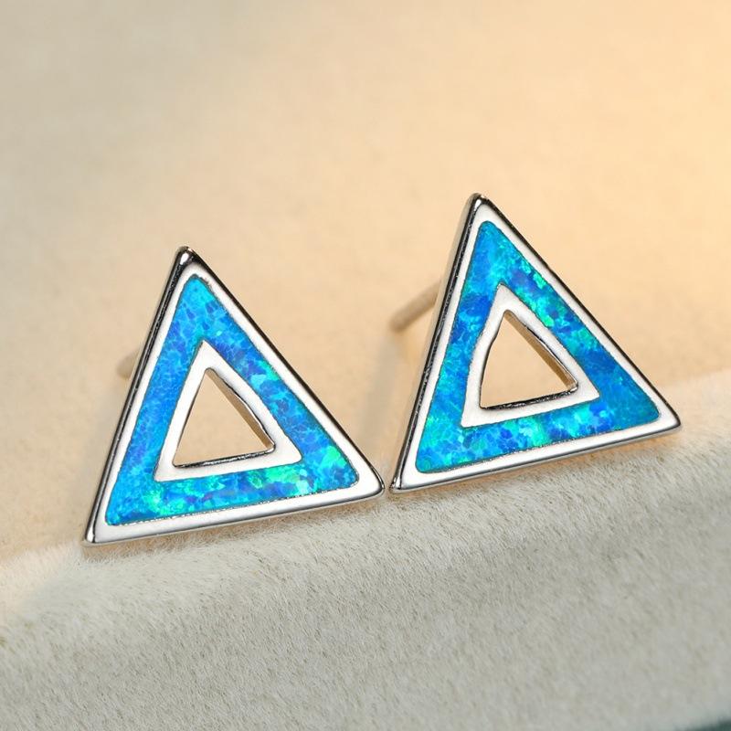 Simple and stylish platinum blue and white hollow triangle women s versatile stud earrings