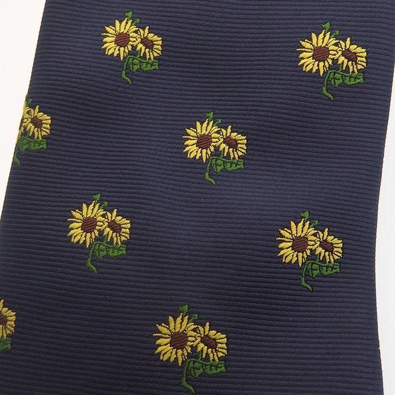 A and unique tie featuring a row of [CUFFSMANIA] cute, fun, sunflowers.