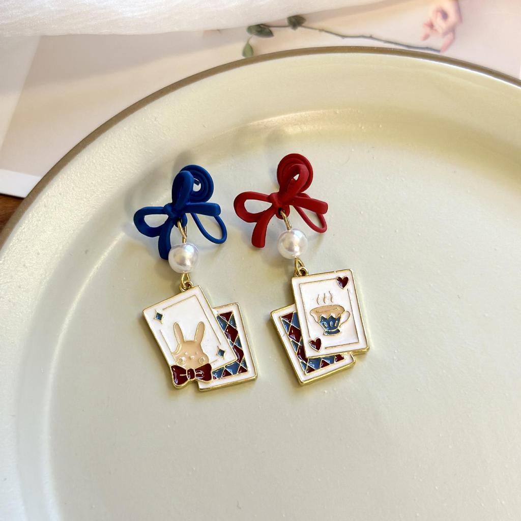 Asymmetrical Poker Rabbit Bowknot Earrings with Silver Needle Stud and No-Pierce Clip.