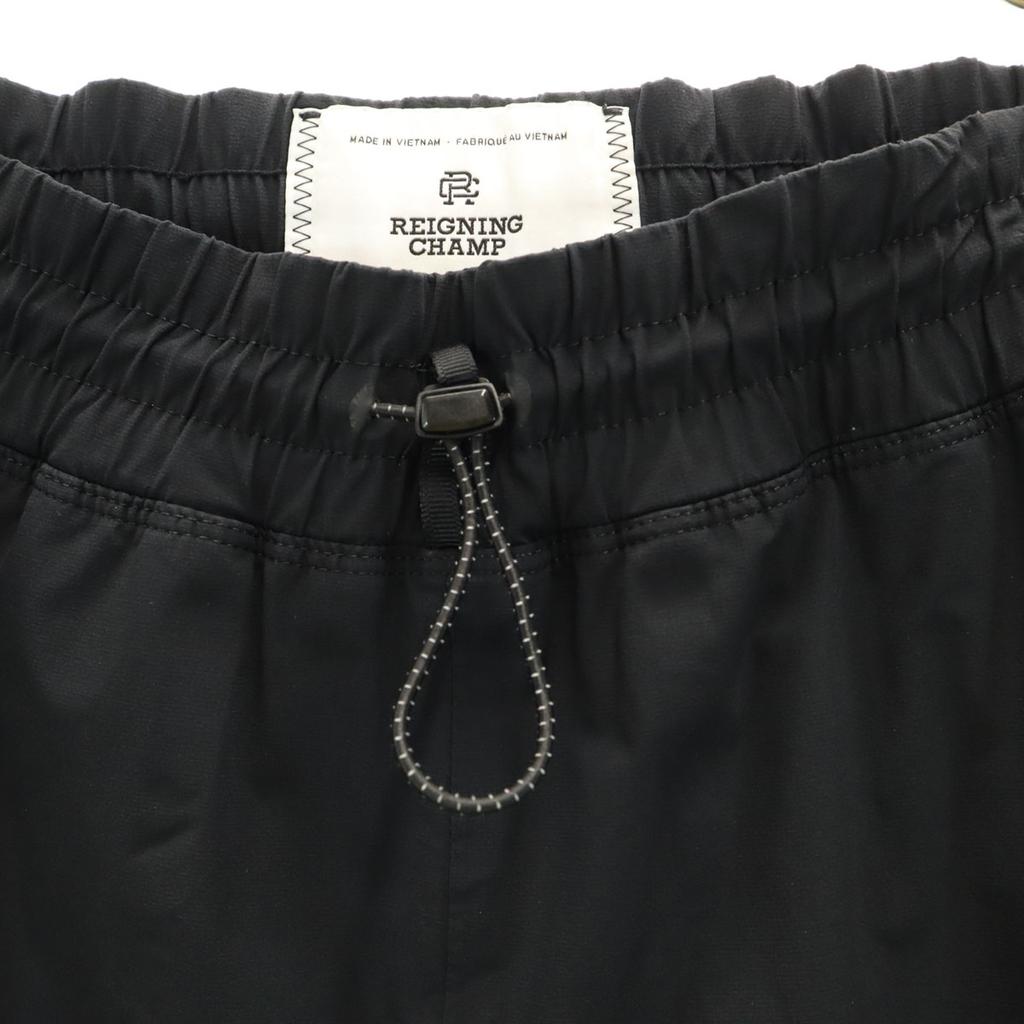 REIGNING CHAMP Spodnie wiatrówki L czarne Męskie Używane