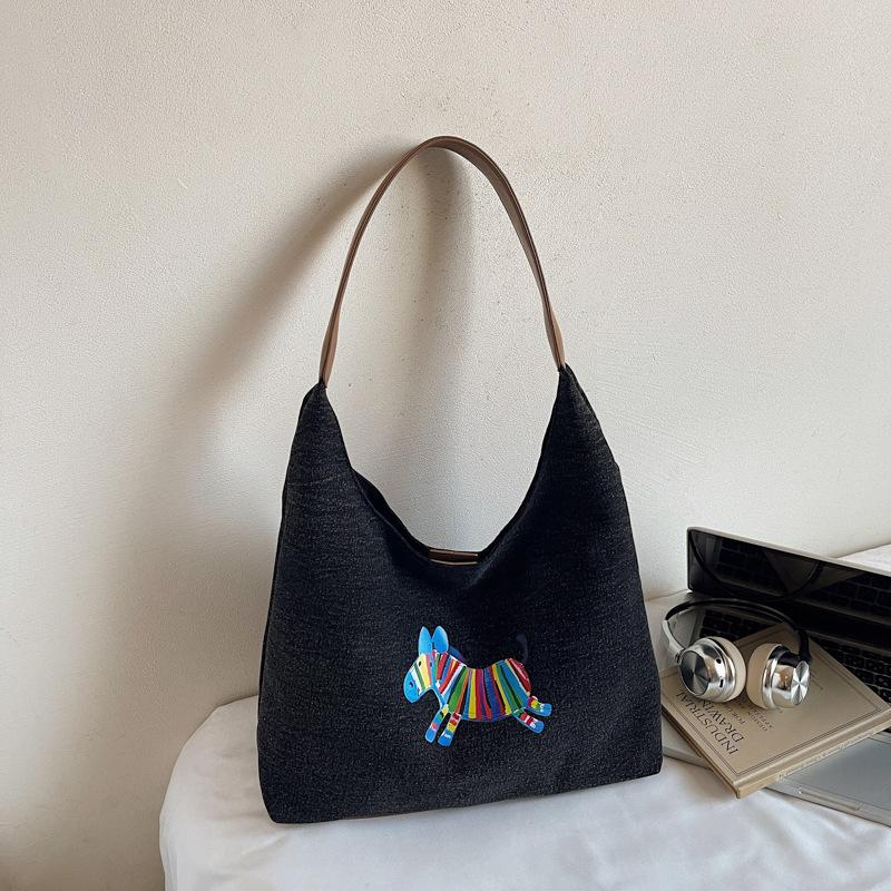 Korean version of commuter large-capacity canvas bag women's 2025 autumn new literary style simple fashion cartoon shoulder bag