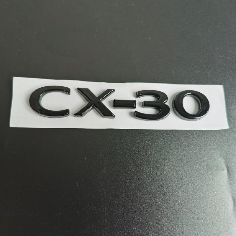 Mazda CX-30, CX-4, and CX-5 Glossy Black Badges: Numerical, Trunk Letter, and Tail Displacement Badges.