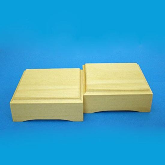 

Shogi Hiba Komadai 2 inch tabletop next to Kaya