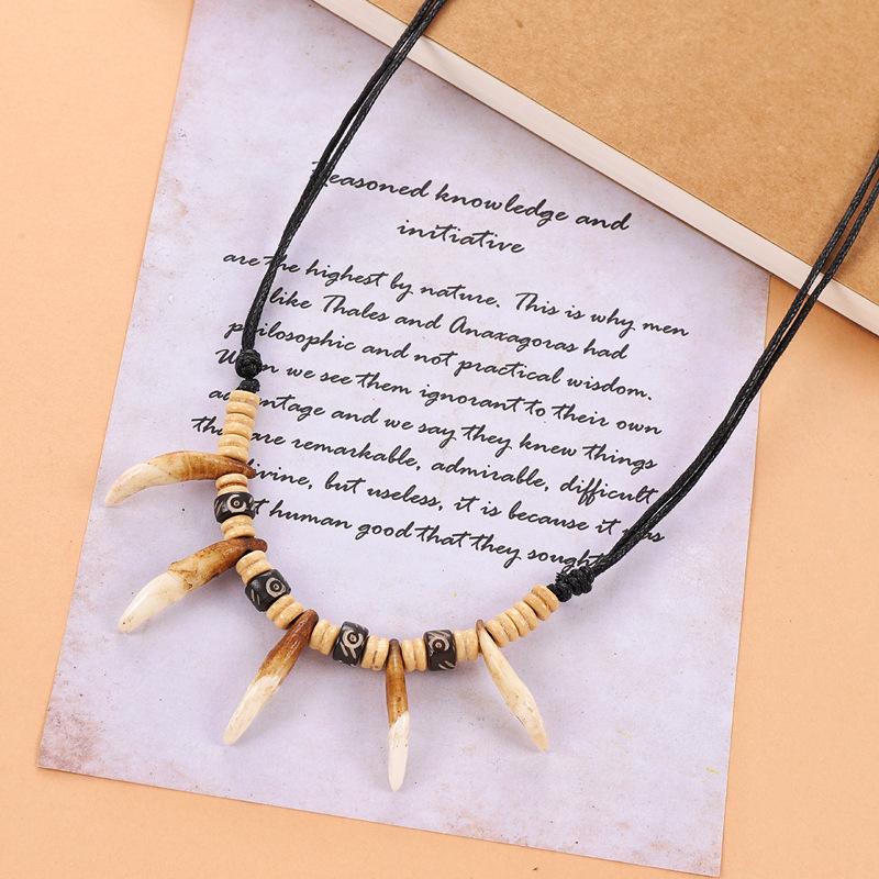 

Винтажное ожерелье с зубом собаки Мужское и женское Личность Тибетская кость яка Подвеска Дикая подвеска Племенные аксессуары с волчьим зубом