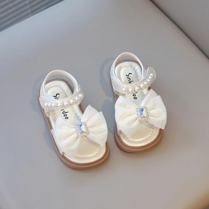 

Кристальные пляжные сандалии для девочек с жемчужной вышивкой Мода 2025 Лето Новые детские сандалии с бантом и стразами Принцесса Горячие 21 бежевый