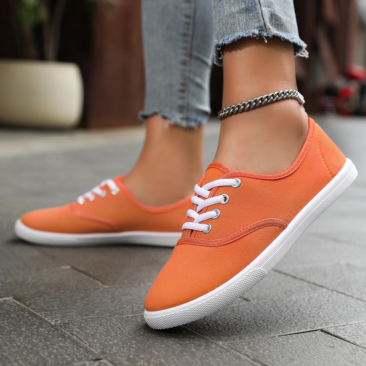 

Men s and women s solid color canvas sports shoes, simple style lace up flat shoes, casual and lightweight student shoes 45