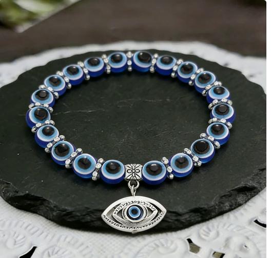 Evil Eye Beaded Bracelet with Round Glass Beads and Metal Eye Charm Stretch Adjustable Jewelry for Everyday Wear and Gift Giving