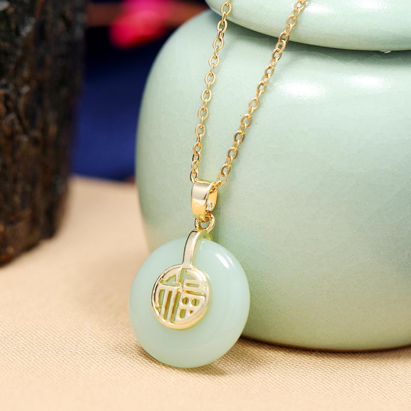 Chinese style imitation Hetian jade safety buckle necklace women's retro temperament titanium steel clavicle chain gold inlaid jade pendant with