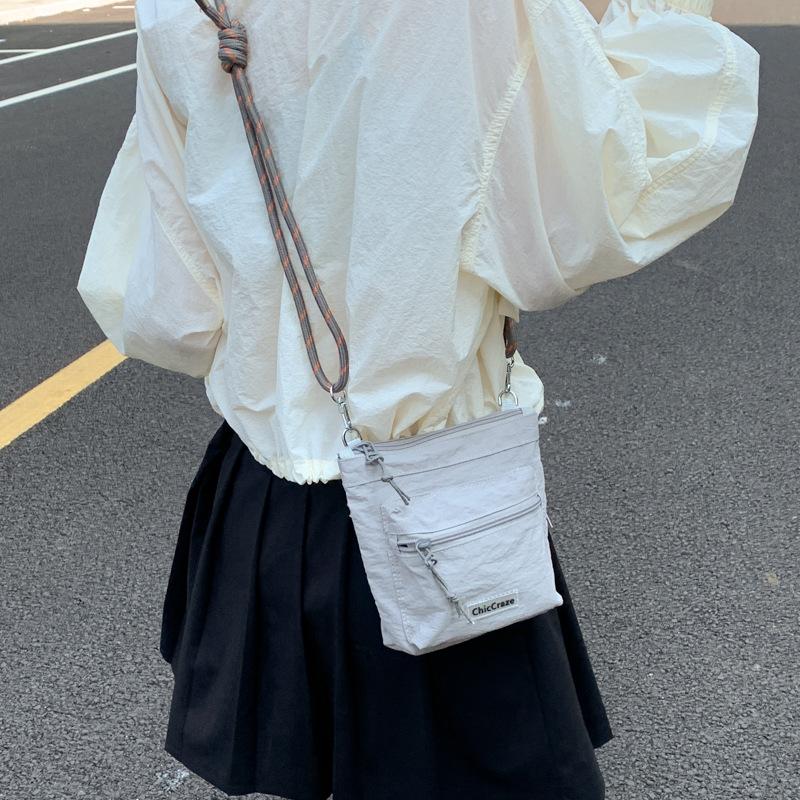 Shoulder bag women's solid color couple outdoor summer new lightweight messenger bag men's and girls outdoor sports small satchel