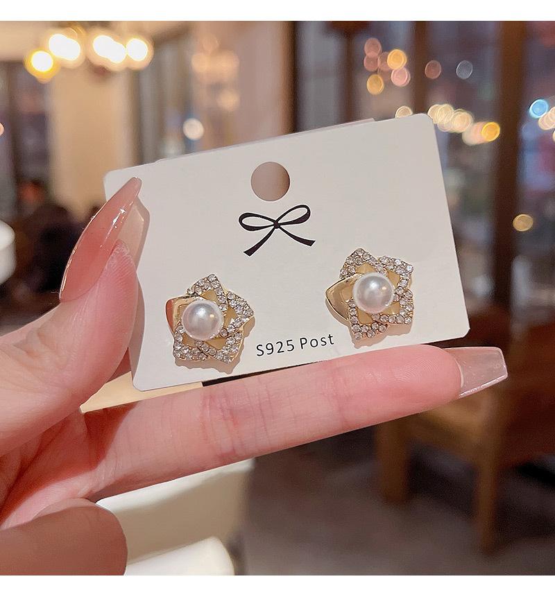 Exquisite diamond studded rose earrings with a luxurious and socialite style design, featuring pearl earrings and earrings