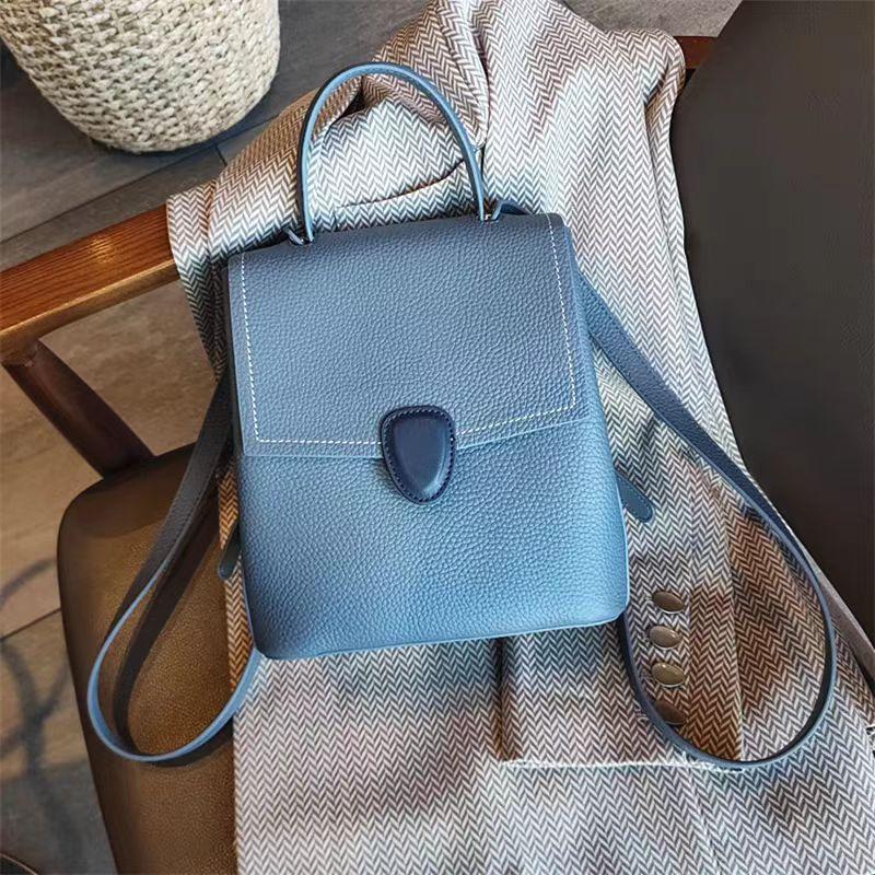 A new type of genuine leather women's bag with a top layer of cowhide and a two-tone color backpack, a simple and casual commuter women's bag