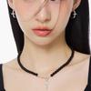 NIMBUS SHINE CROSS ONYX DROP BALL NECKLACE
