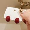 Hong Kong Retro Red Bean Earrings: Elegant Wine Red Studs, Hepburn-Inspired, Versatile, Fashionable Accessory.