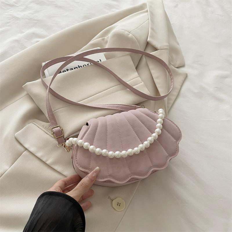 

Niche Korean version shell bag 2025 autumn new bag women s fashion simple shoulder bag casual commuter messenger bag розовый