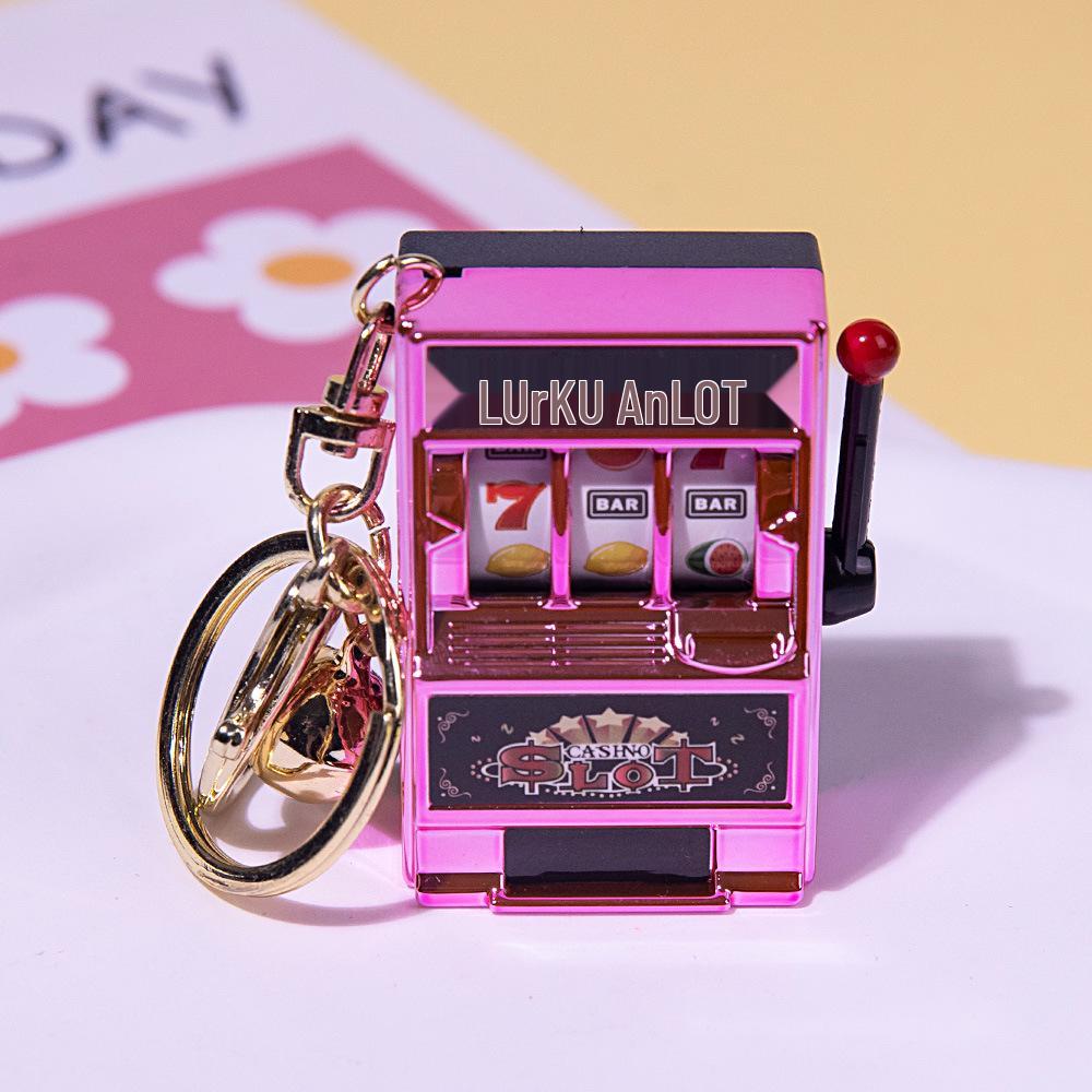 

Gold-Plated Creative Tiger Fruit Machine Keychain Toy with Lottery Play Feature