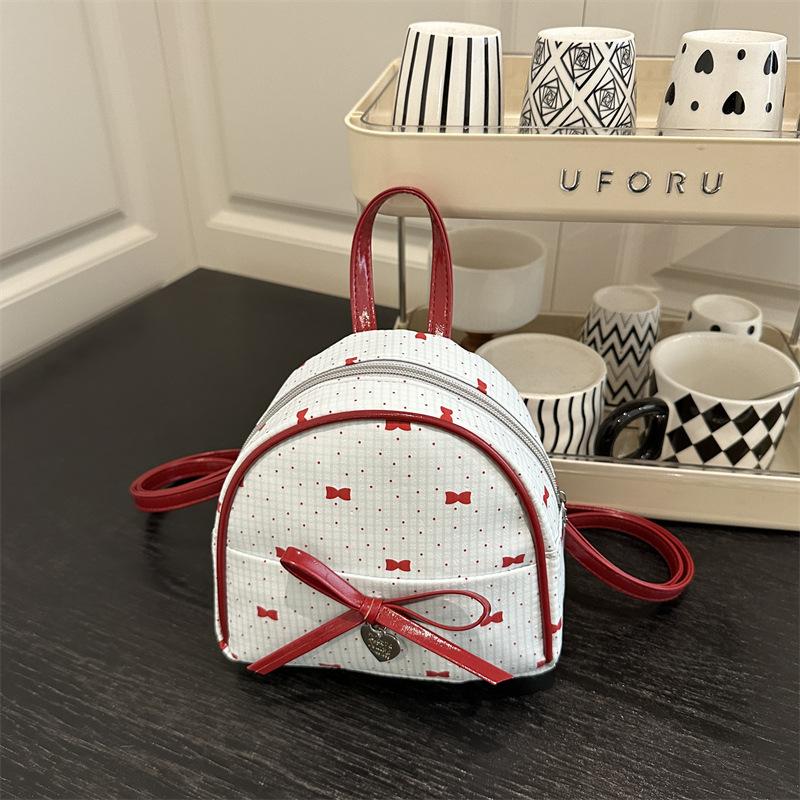 Schoolbag Korean version of college style women's shoulder bag 1011 new summer fashion bow small backpack shopping commuter bag
