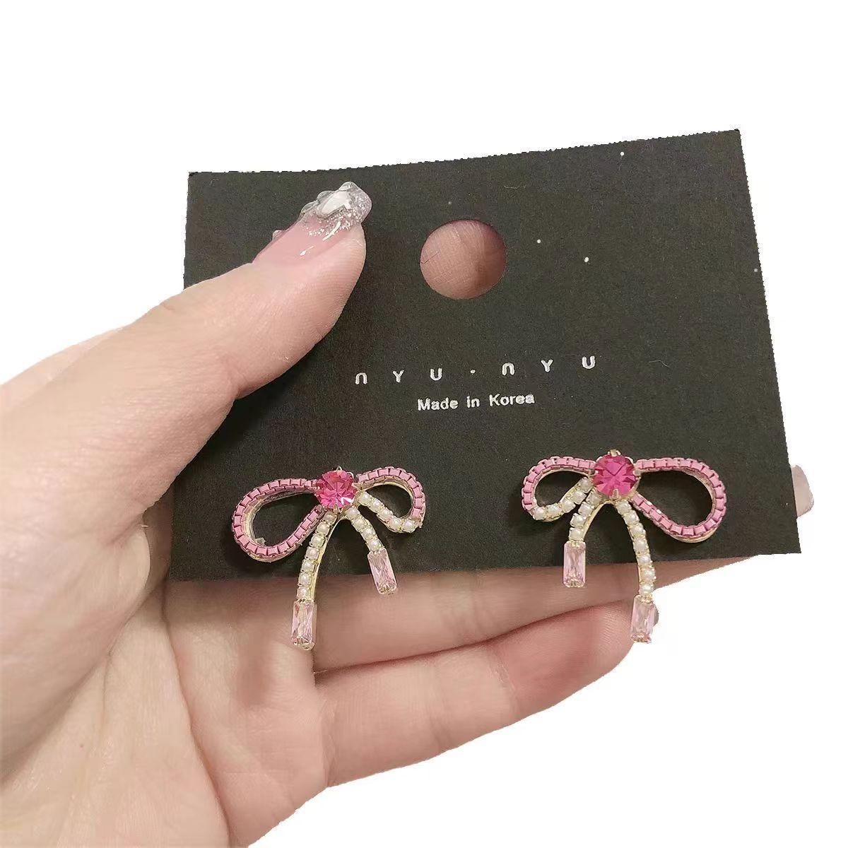 nyunyu Korean jewelry Dongdaemun earrings sweet niche design earrings hollow pink bow stud earrings