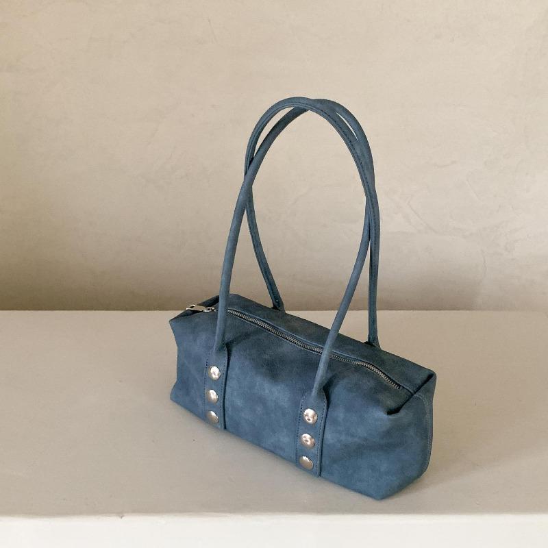 

Retro baguette bag, rivet trend, new armpit bag, niche portable shoulder bag for women синий