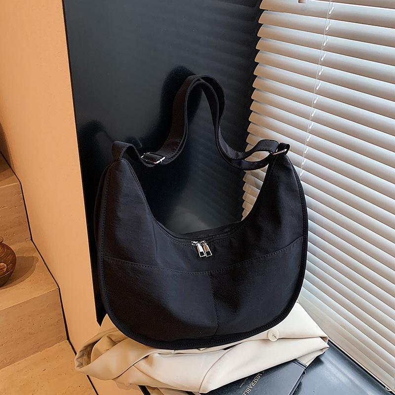 Canvas bag women's large-capacity new niche design sense summer shoulder messenger bag versatile commuter dumpling bag