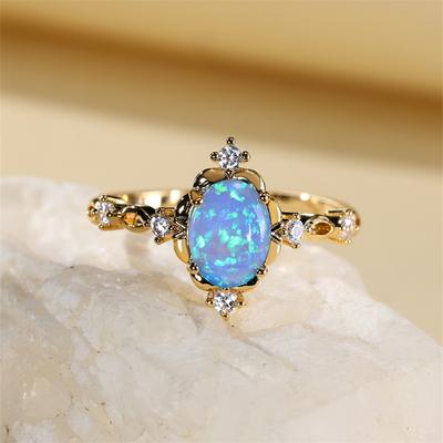 Oval geschliffene Mystic Blue White Fire Opal Ringe für Damen Goldfarbe Charm Regenbogen Geburtsstein Eheringe Braut Verlobungsring Zirkonia