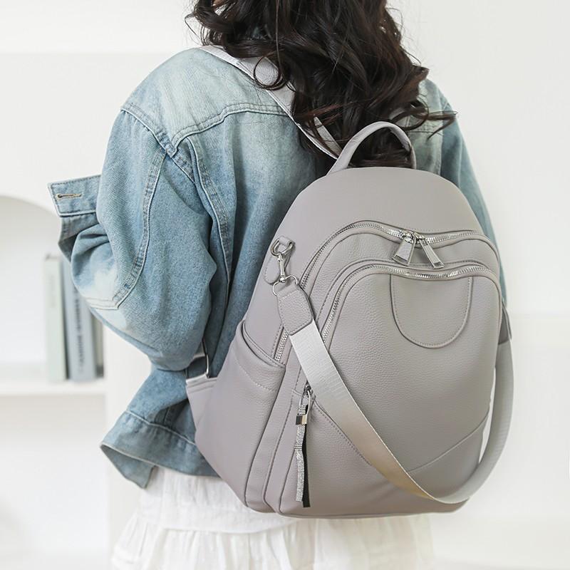 Sac à dos simple couleur unie pour femme grande capacité urbain polyvalent sac de travail texture PU fonctionnel sac à bandoulière décontracté