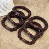 Versatile Black Elastic Hair Tie with Durable Leather Case