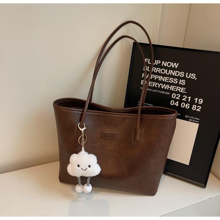 

Простая ретро сумка-тоут женская 2025 новая модная вместительная универсальная сумка для поездок на работу повседневная сумка на плечо под мышкой темно-коричневого