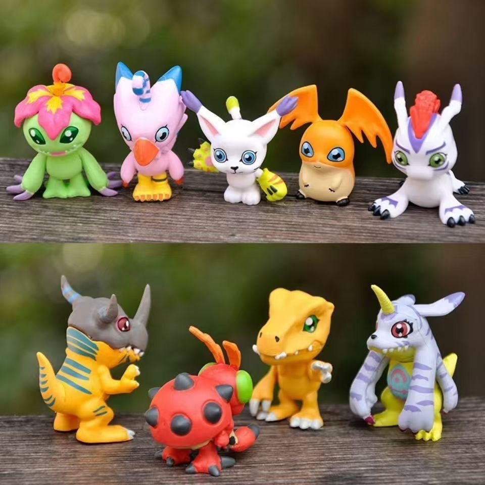 9-piece set of cute Japanese Digimon Adventure anime figures, including Agumon, Patamon, and Gabumon. PVC tabletop figurines.