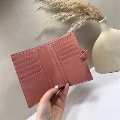 Nova versão coreana de carteira feminina média e longa bolsa de mão de moda carteira tecida de couro de ovelha porta-cartões atacado