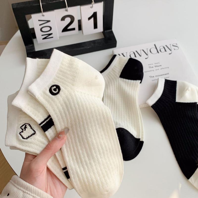 A Woman Wearing Summer Mesh Black and White Simple Embroidered Lettering Ultra-thin and Breathable Short Socks