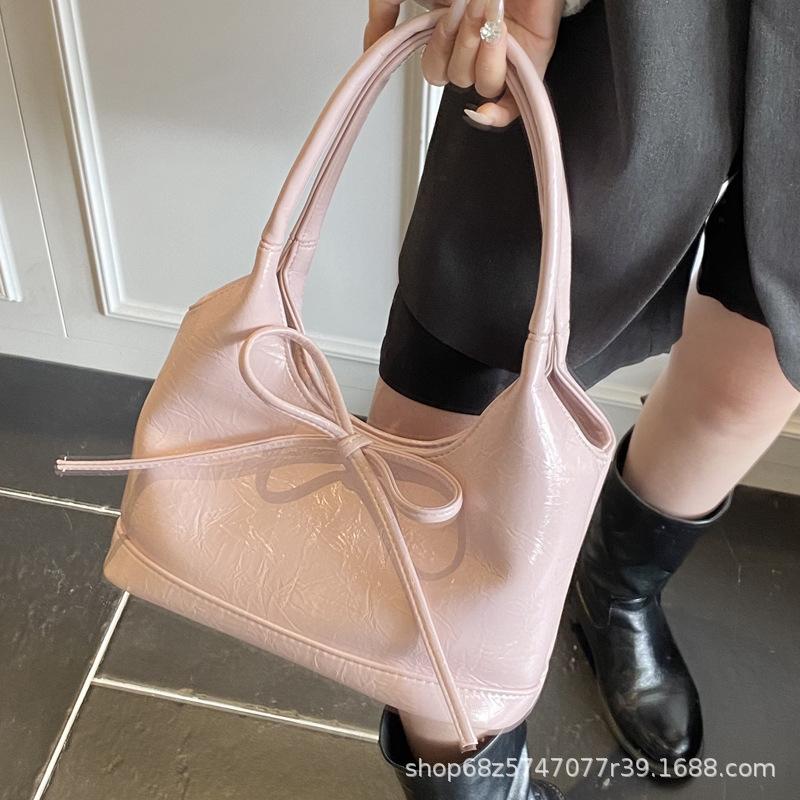 Bow niche portable bucket bag women's 2025 new trendy fashion simple commuter casual shoulder bag