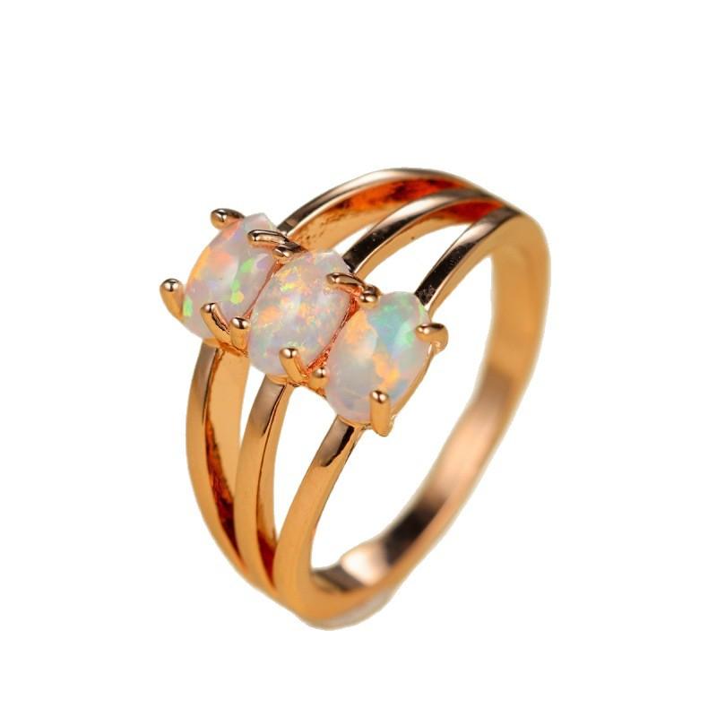 Hot-selling three-layer four-claw inlaid Opal OPal ring temperament simple personality unique ring