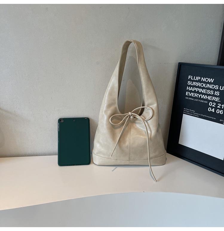 Koreanische, stylische Handtasche mit großem Fassungsvermögen und Schleifenverschluss – trendiges Design für Damen