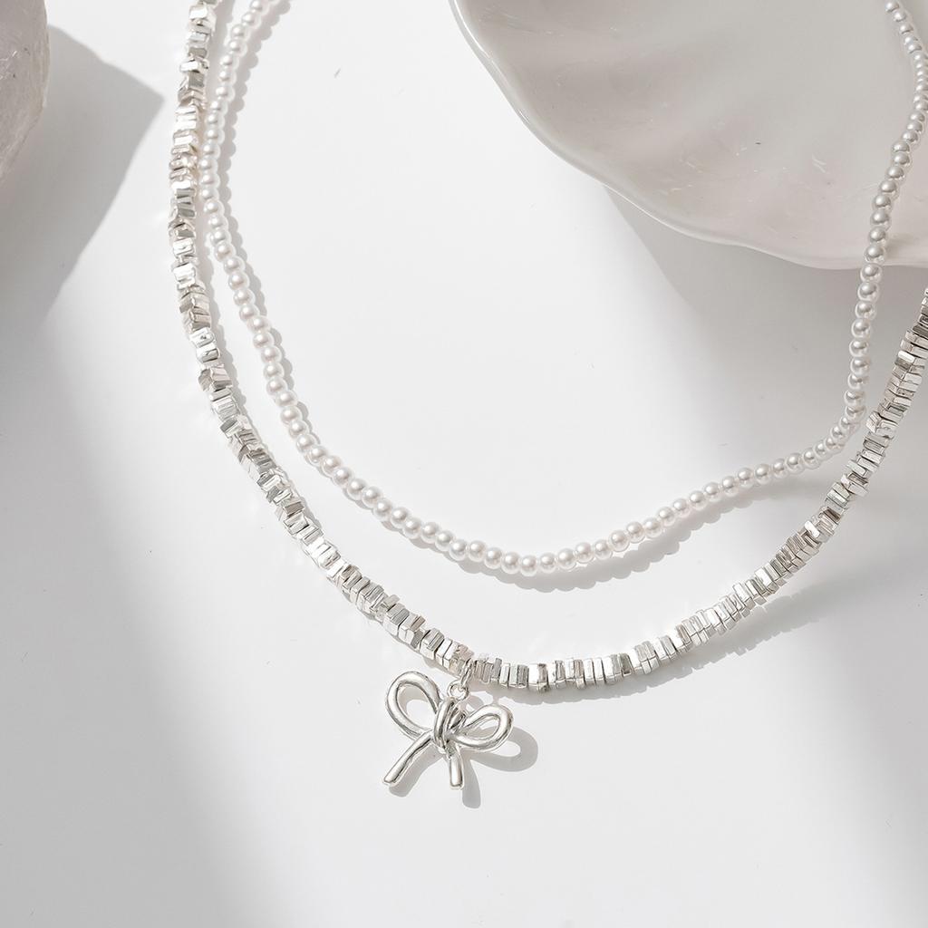 New bow necklace women's simple high-end sense retro double-layer stacked wear design sense imitation pearl collarbone chain
