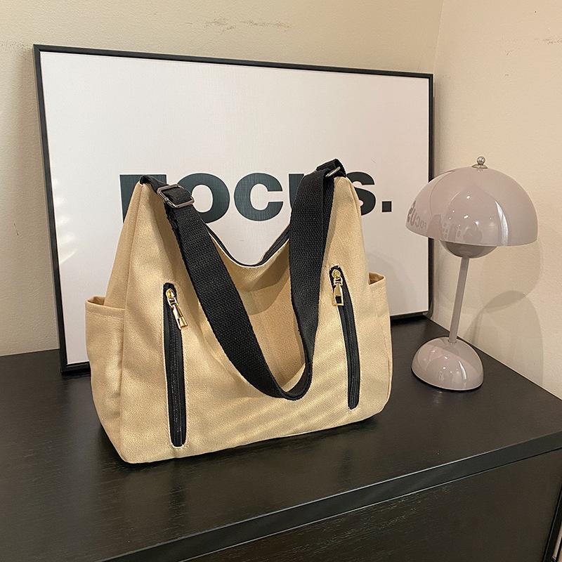 New simple trend Korean version messenger bag women's shopping with change bag niche design shoulder women's bag